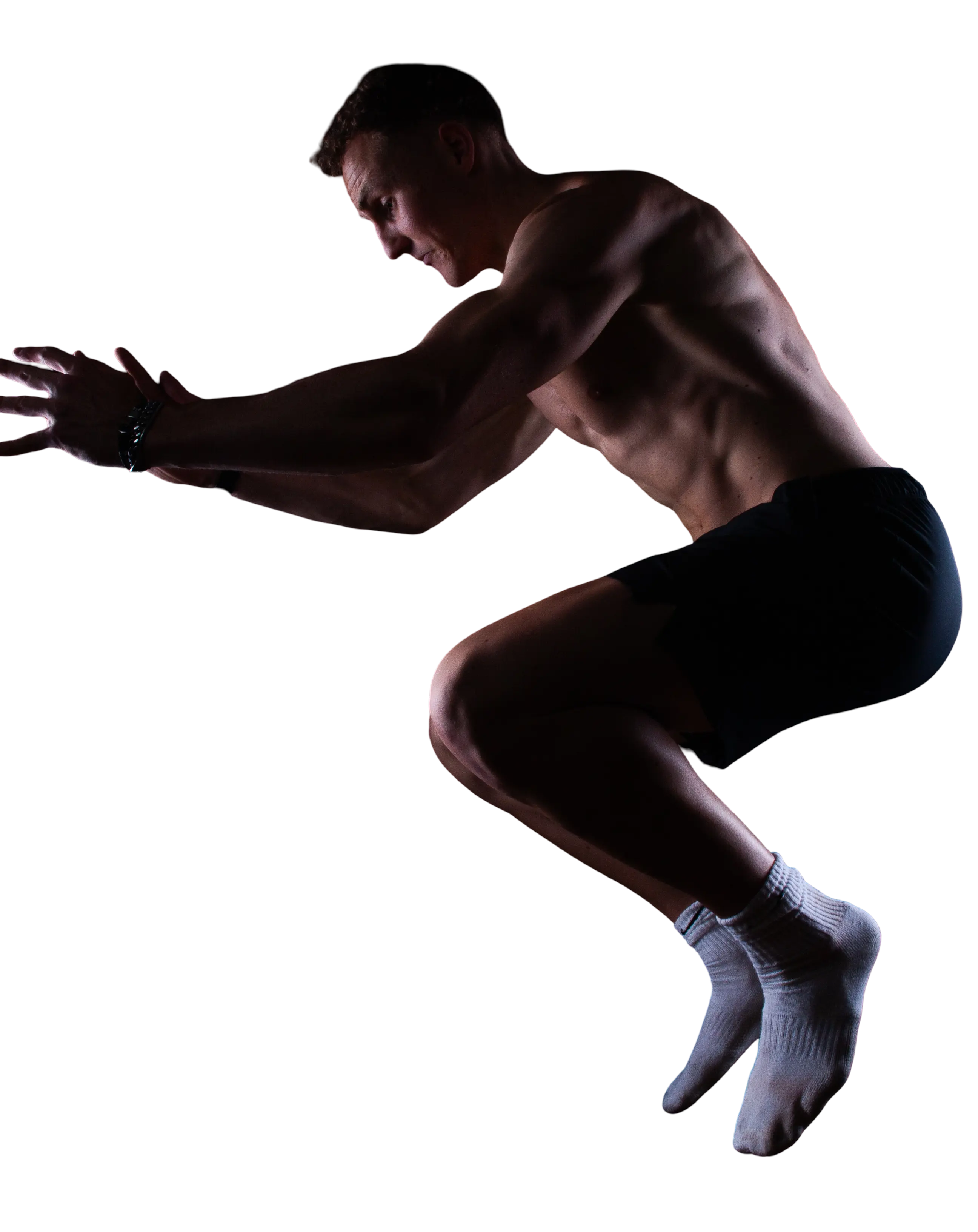 Athletic fitness coach in dynamic jumping pose
